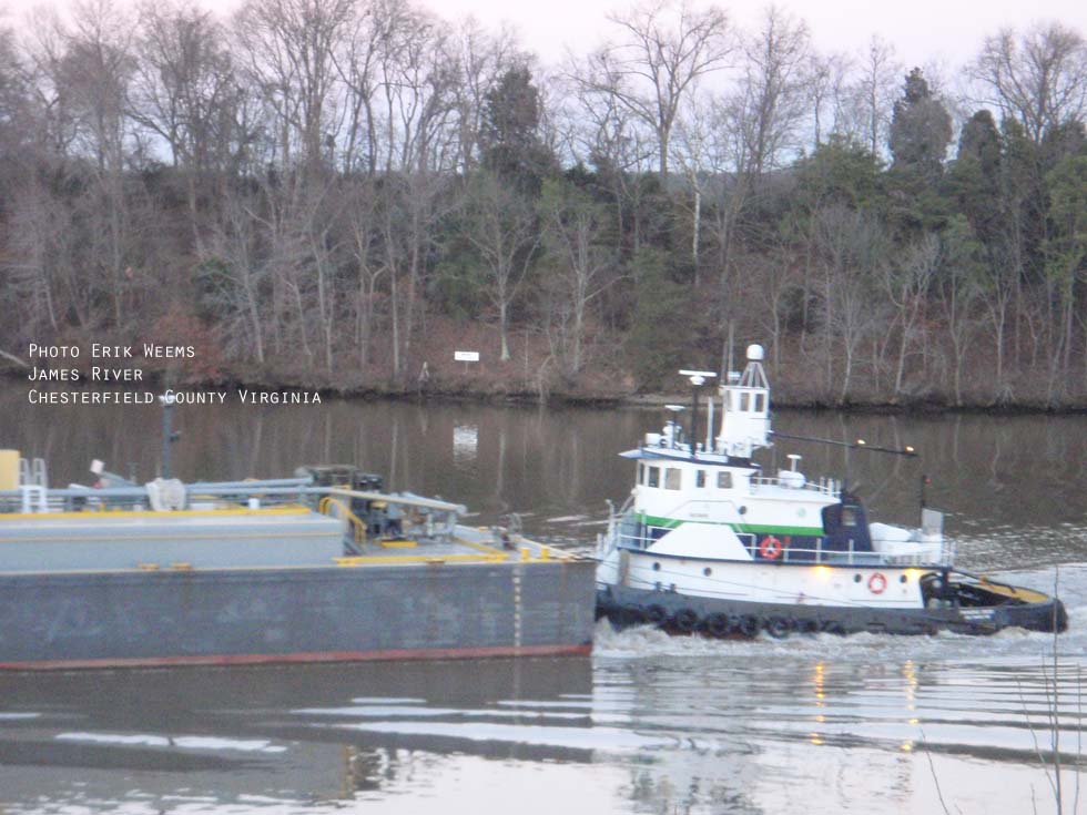 Tugboat and Barge coming up James River Chesterfield Virginia